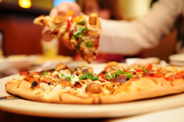 Dukes Pizza Plus in Fowlerville, Michigan, Spreads Holiday Cheer with Christmas in the Ville Parade Specials